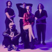 The five band members of just mustard in a photo studio